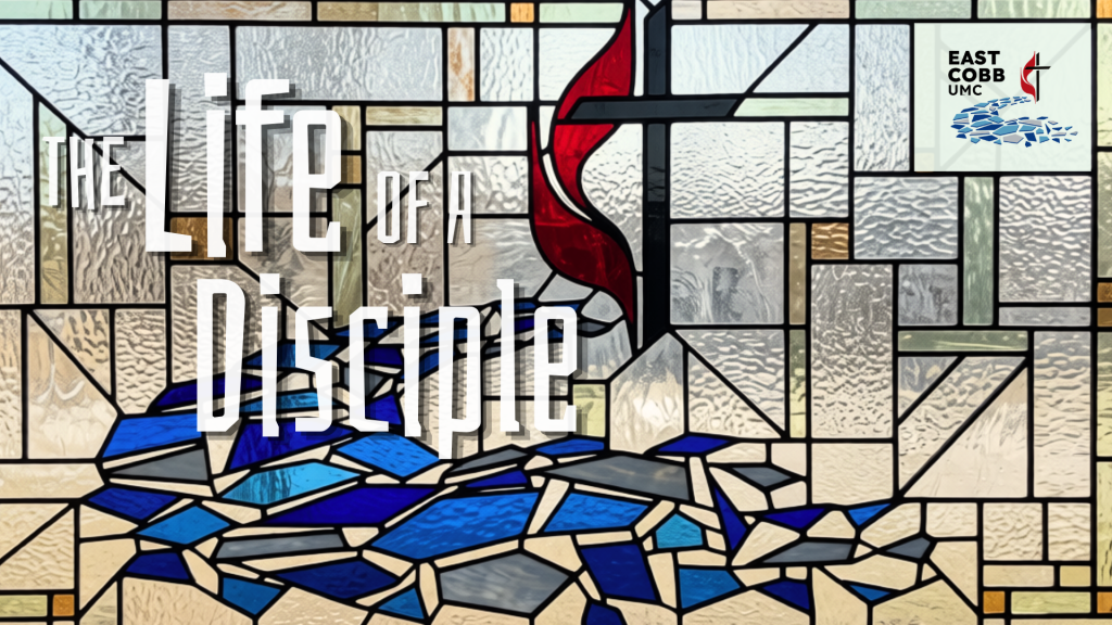 Stained glass window with a red flame and cross design, featuring the text "The Life of a Disciple" and the East Cobb UMC logo in the corner.
